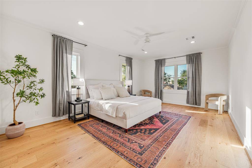 Love this light-filled primary bedroom? Just wait until you see the spa-like primary bath!