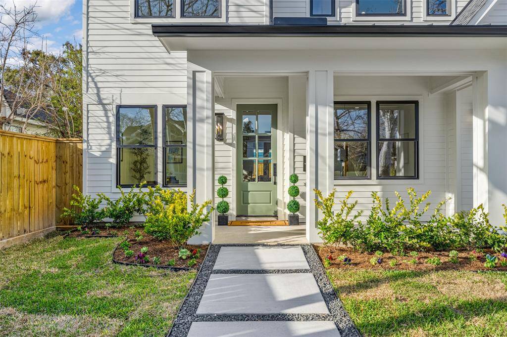 A welcoming front porch designed for relaxation, complete with charming details that complement the home’s timeless style.