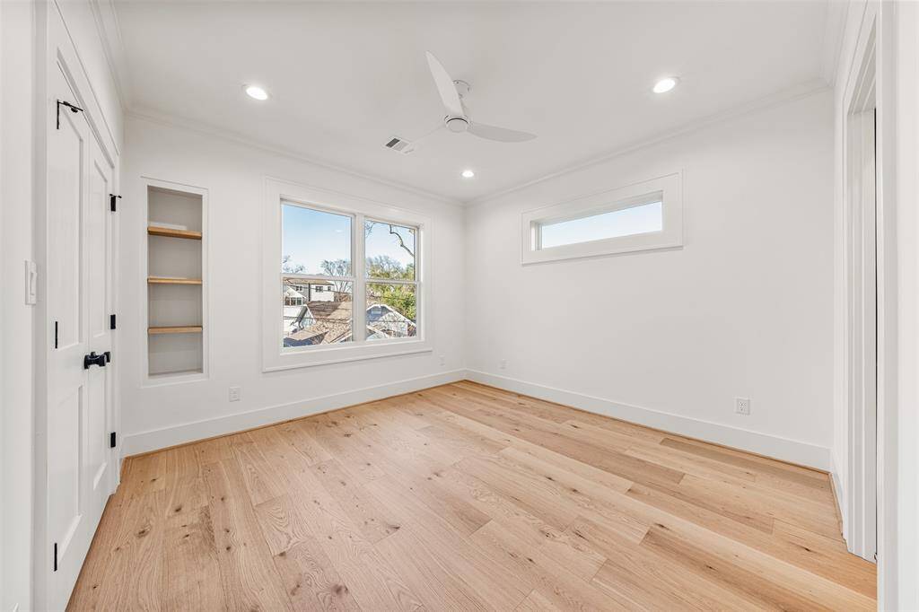 A second-floor bonus room designed for convenience, complete with built-in storage and thoughtful details.