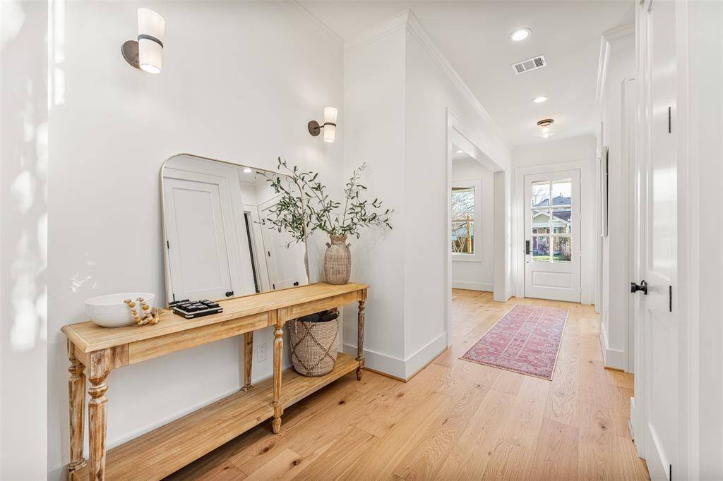 Throughout the home, you'll find beautifully crafted white oak flooring, elegant oak accents, and timeless brass details.
