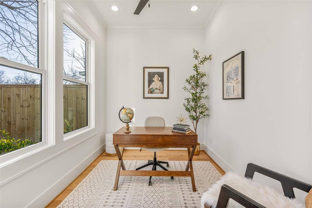 The front office offers a quiet, stylish workspace with plenty of natural light and a prime location at the front of the home.