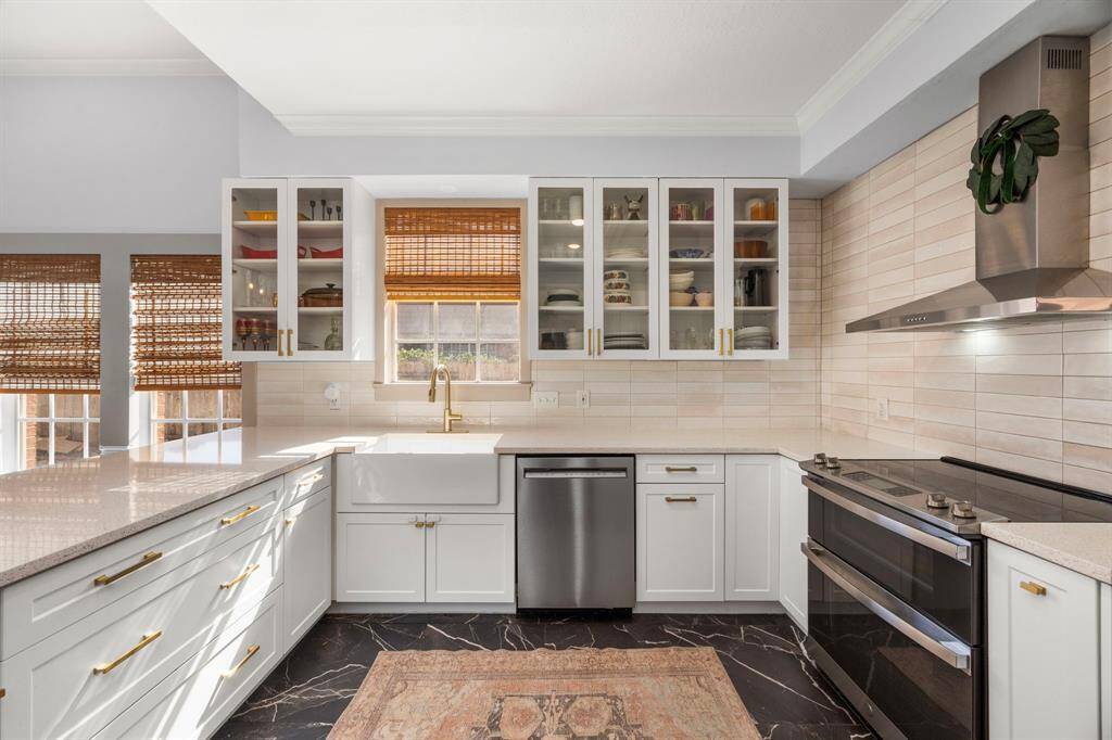 Huge primary suite overlooks the beautiful backyard.