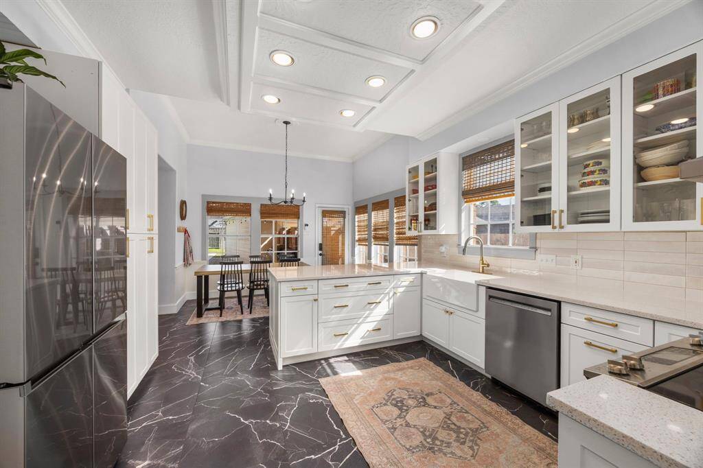 Huge primary suite overlooks the beautiful backyard.