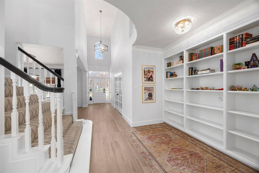 Gorgeous entry with the formal dining to the left and the office behind french doors to the left.