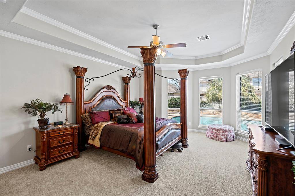 Welcome to your serene primary retreat!  A wall of bay windows offers wonderful views of the backyard space!