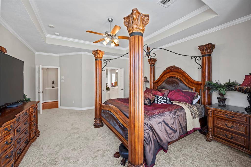 And the ceiling is gorgeous with the tray inset with crown molding!  Soft carpet under foot adds to the serenity of this space too!