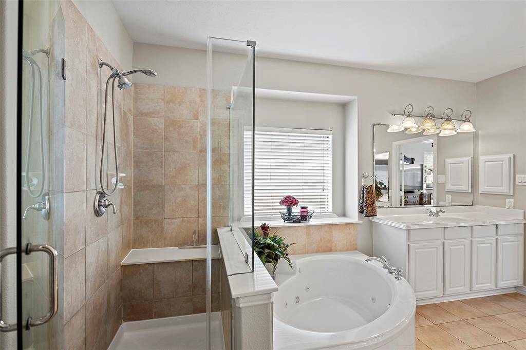 Do you prefer bubbles or steam?  A glass enclosed shower with bench seat and detachable shower head will let you relax and linger in the steam, and the whirlpool garden tub will help wash away the cares of the day!