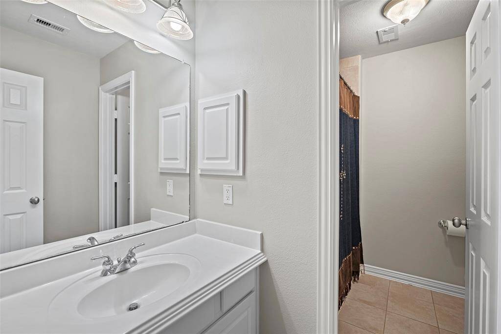 A full sized bathroom has a vanity area and separate wet area too!