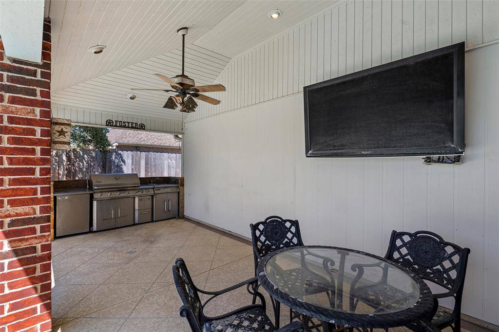 There is even a seating area for dining al fresco or pulling up chairs and watching the big game!  Actually, you could be floating in the pool watching the game from there too! The added bonus is this amazing outdoor kitchen with grill, sink and mini-fridge!  Backyard BBQ's will never be the same!