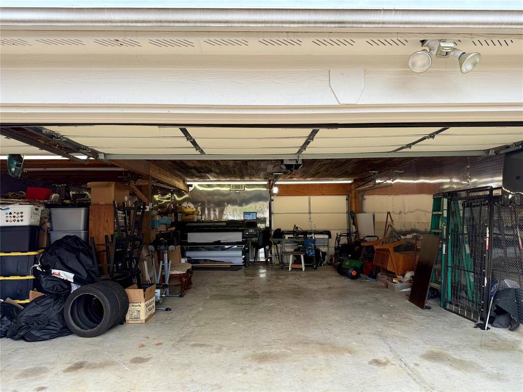 3 Cars wide and 2 cars deep, with A/C and Heat and diamond plated insulation on the walls.  Plenty of space for a Man Cave or workshop and still have room for cars and storage.