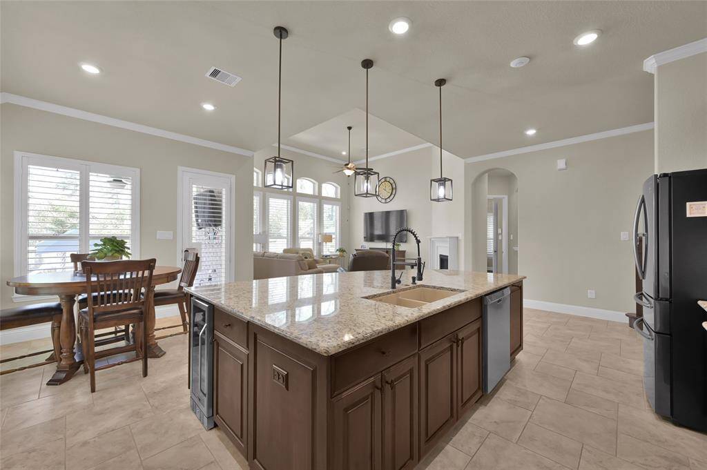 This kitchen will surely check EVERY box on your wish-list! It even includes the existing refrigerator AND the cabinets also include a drawer space for the trash recepticle to keep it neatly tucked out of site!