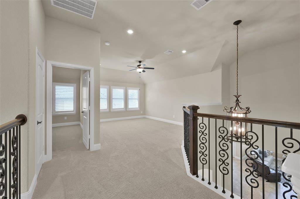 Experience all the fun in this spacious game room-perfect for children's play and entertainment that is thoughtfully situated above the kitchen and not right over the Primary Suite!