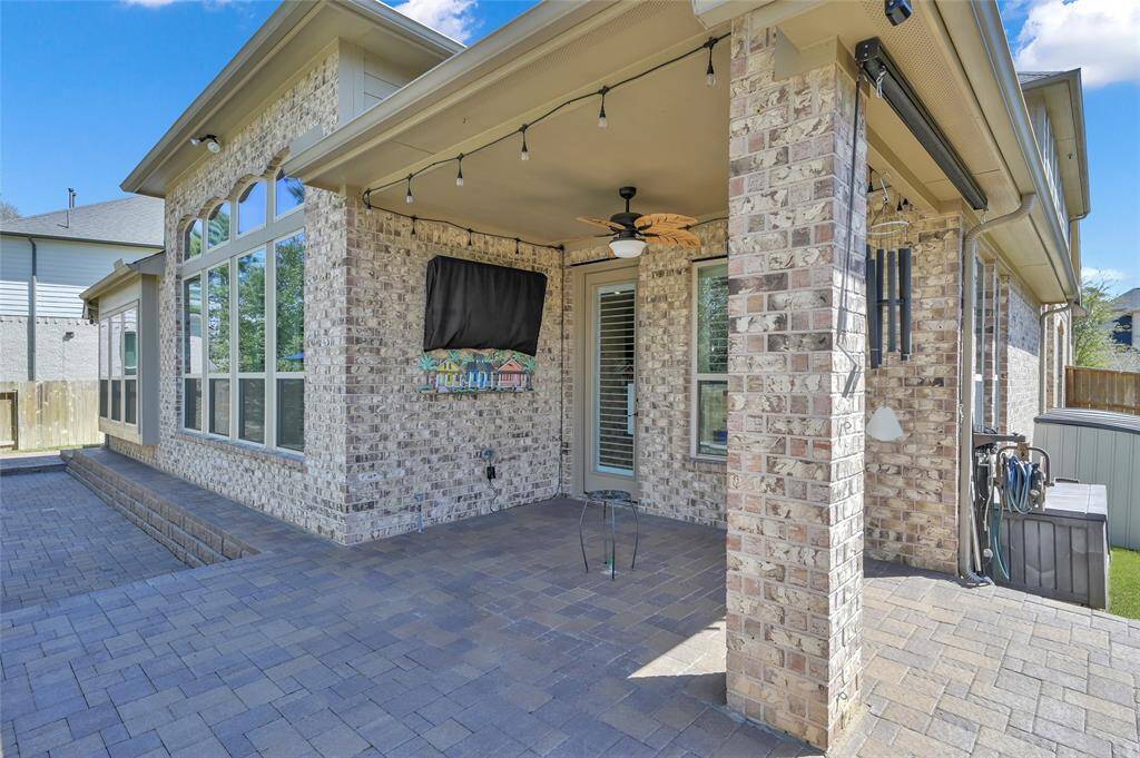 Patio area offers mounted TV, with a gas line if you choose to hook a fire pit in the middle or plenty of space for dining too!