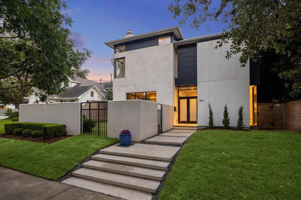 Welcome home to the beautiful limestone, metal and stucco facade of this Kurt Eichler original! The thoughtful design, walled/fenced yard, plate windows and distinctive steel door provide privacy and security. Note the recently re-landscaped turf and shrubs.