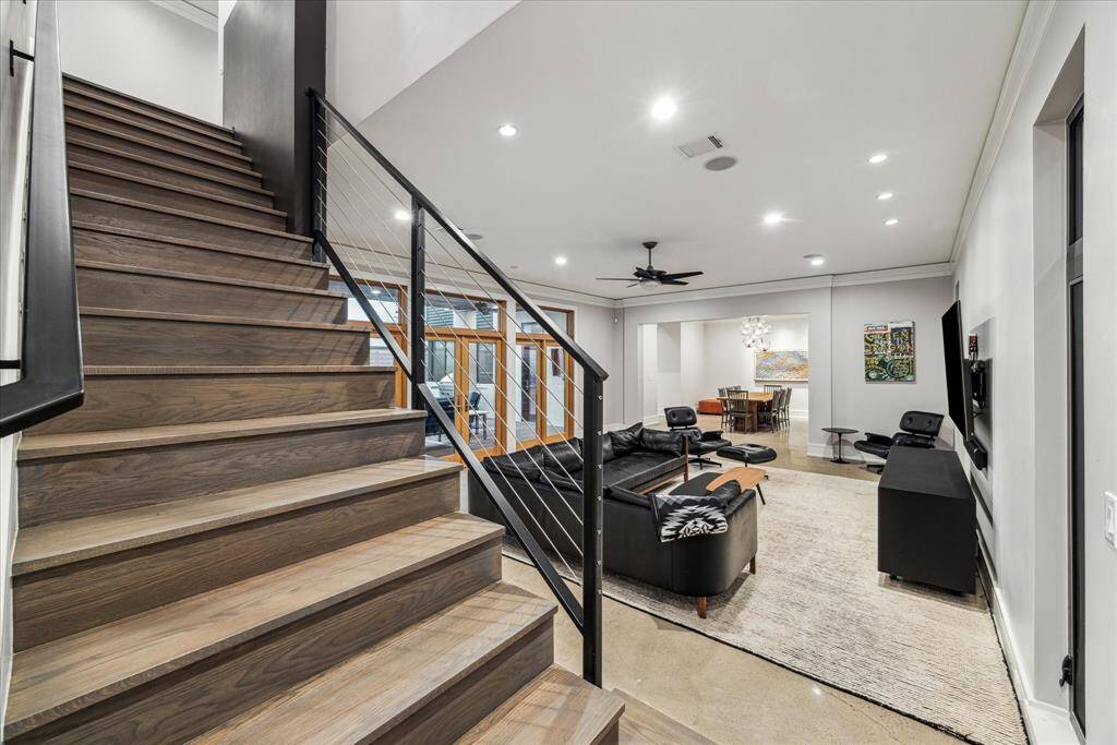 The primary staircase in the living room introduces the beautiful oil waxed oak floors upstairs, recently refinished for you to move right in!  Note the staircase features another black architectural accent, as seen in the living room.  The primary bedroom is separated from the other bedrooms and away from the living area at the top of the primary stairs.