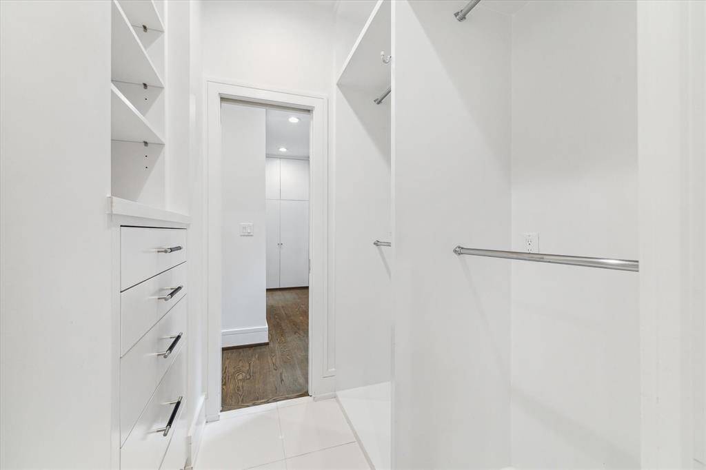 Immediately off the bathroom is this first closet with generous, durable built-ins.