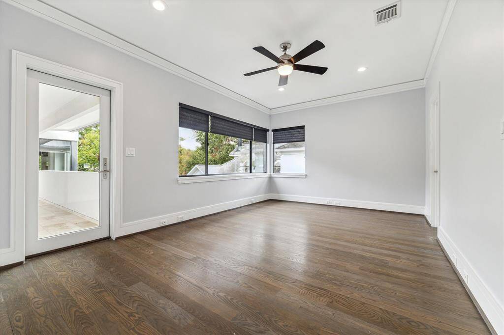 This balcony-connected secondary bedroom has a great view of the deck and offers an en suite bath and large closet as well as elegant blinds.
