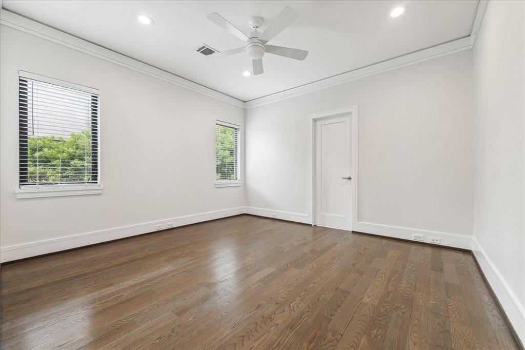 The spacious guest suite bedroom off the game room offers private quarters/family accommodations.  The area is separated by a pocket door in the 2nd floor hall and has direct access to the secondary stairs landing in the mud room/garage area.