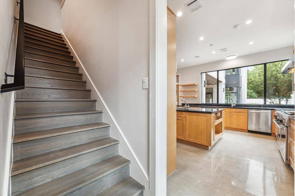 The secondary stairway is great for guests and families, landing directly in the kitchen.  The sellers loved the convenience of the secondary staircase for the kids.