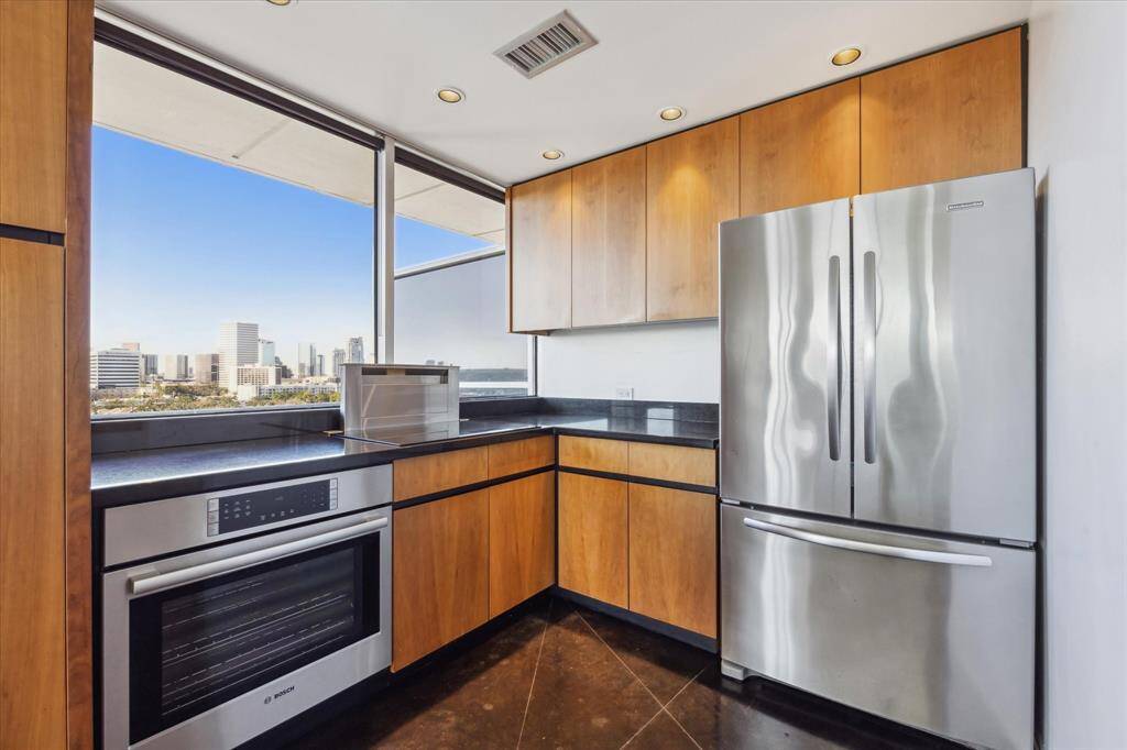 Additional kitchen view shows the large amount of counterspace, storage and thoughtful layout.