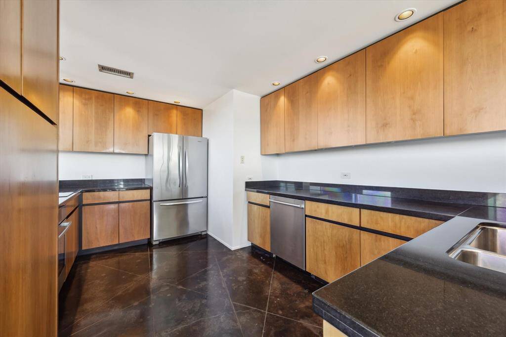 Additional view of living and dining spaces showing South views.