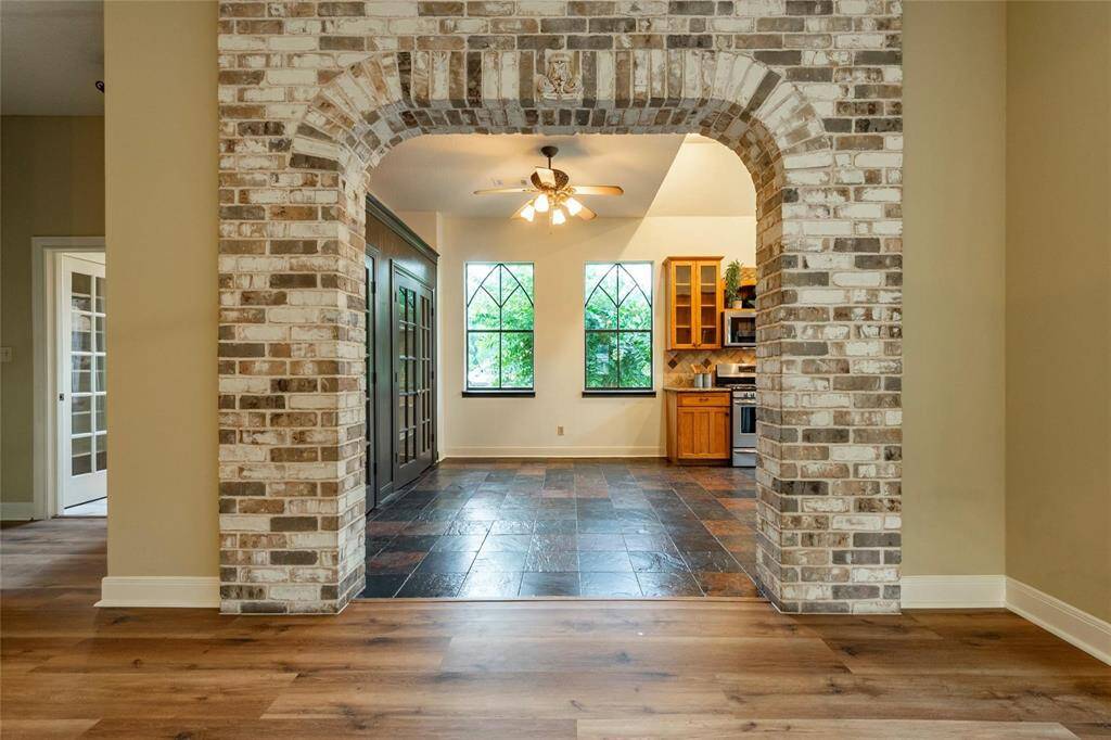 Brick accents the entryway to kitchen and breakfast area.