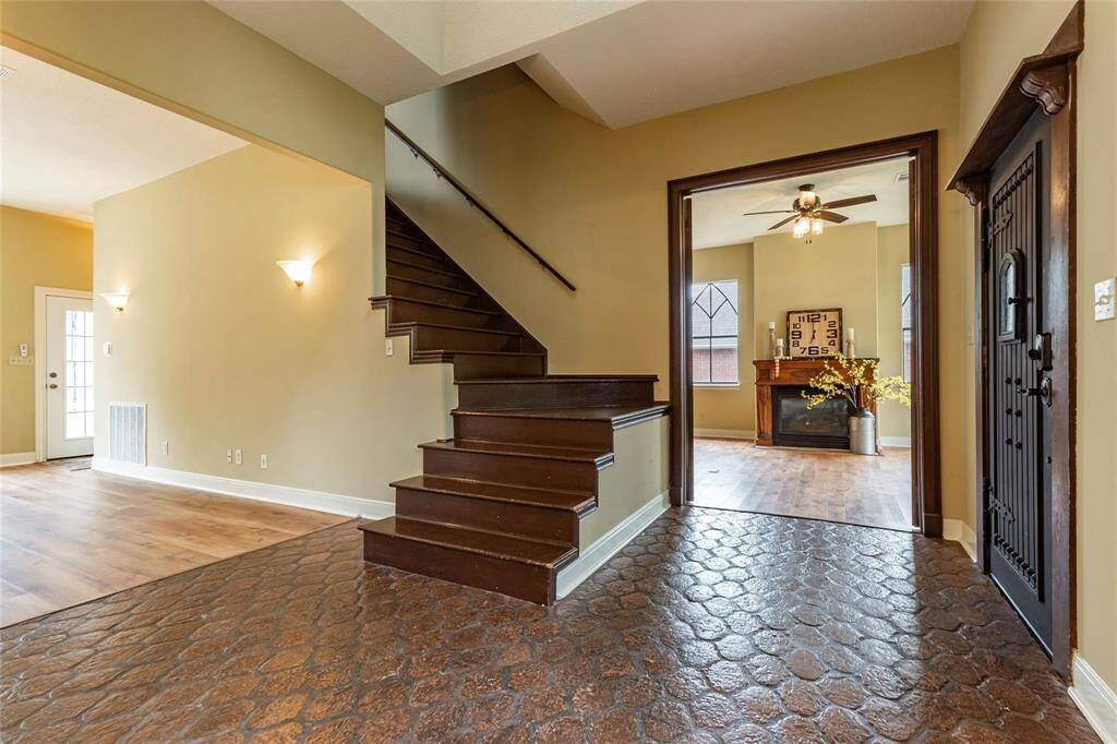 Stair case leading to the second level is in the entryway.