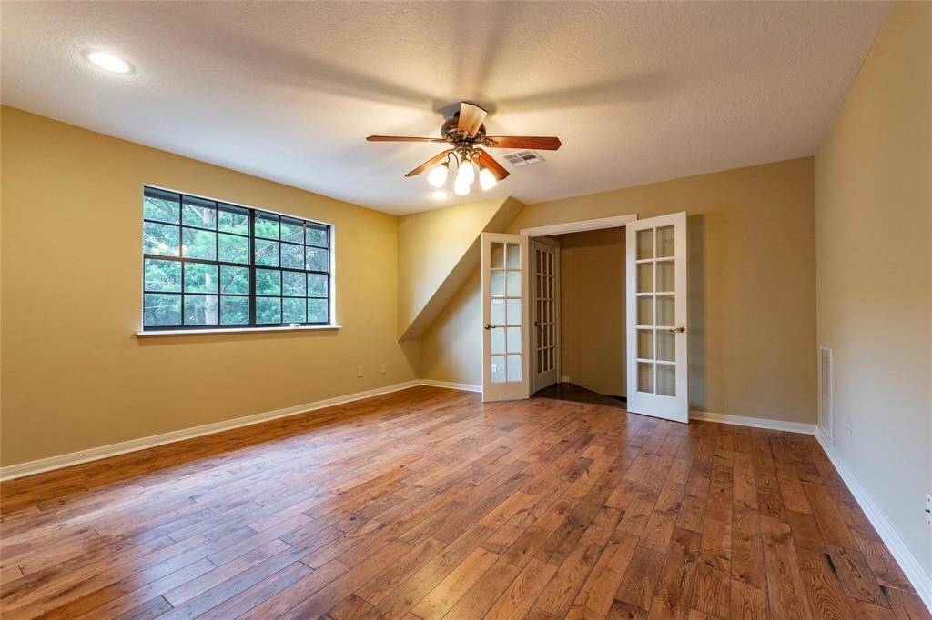 Another view of the upstairs game room with double doors.
