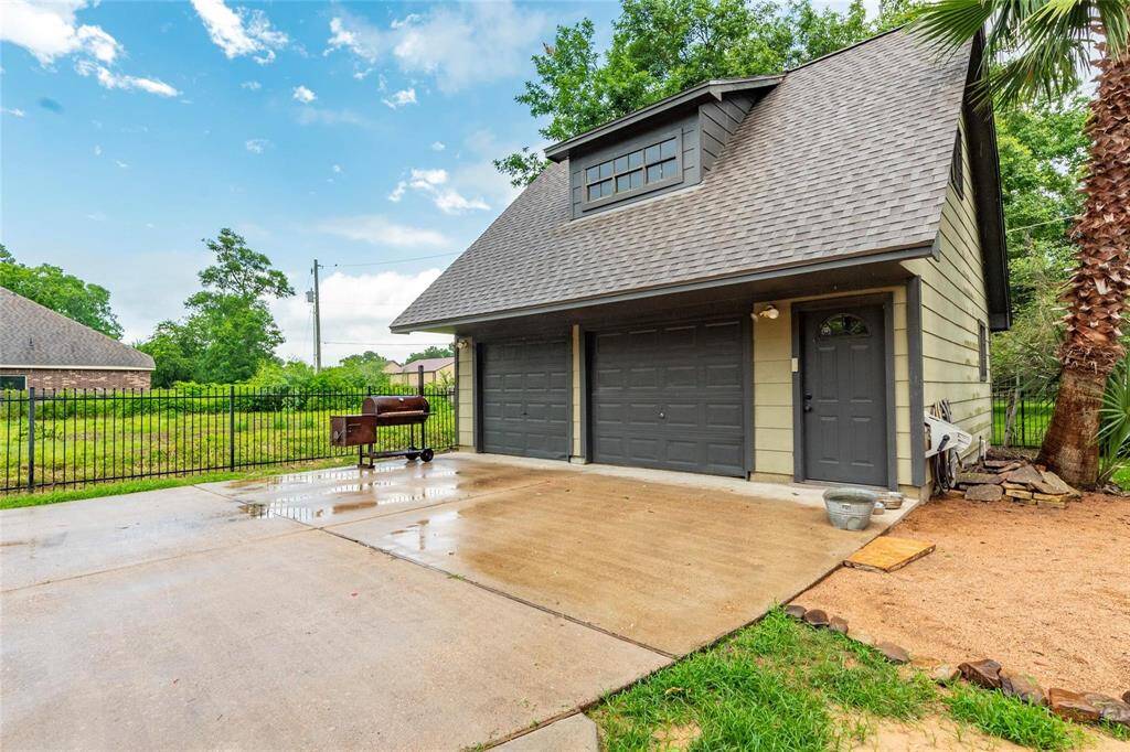 Another view of the detached two car garage with additional parking.