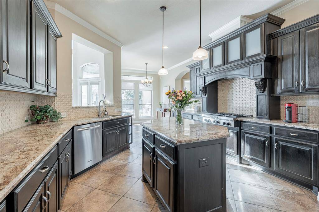 These professional appliances enhance this wonderful work space and entertaining area!