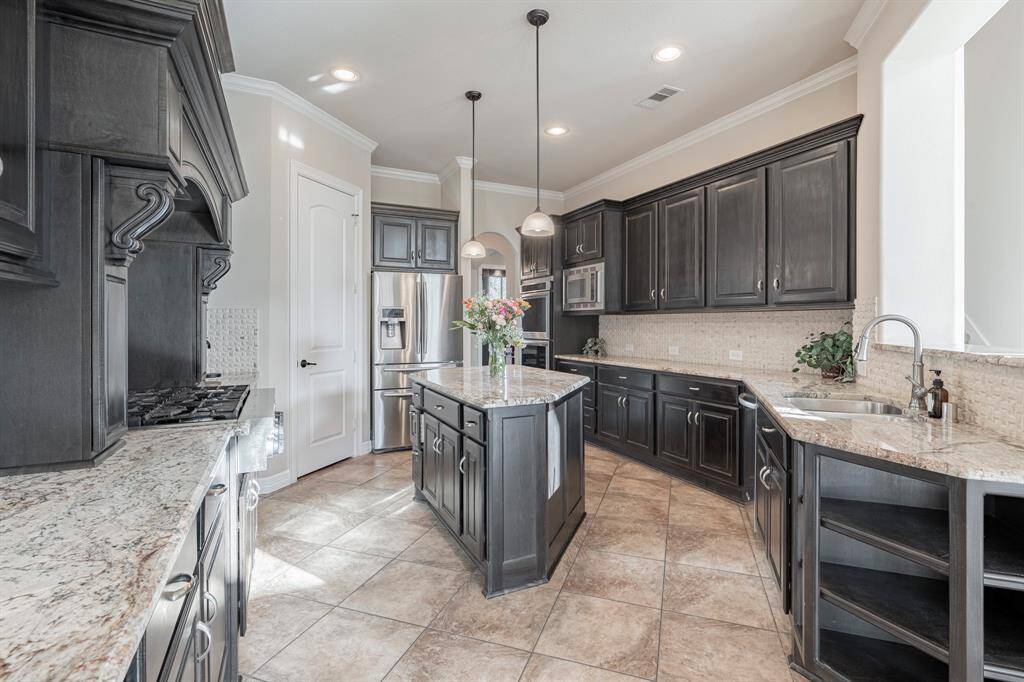 View of the light and bright kitchen and opens to the spacious living room.