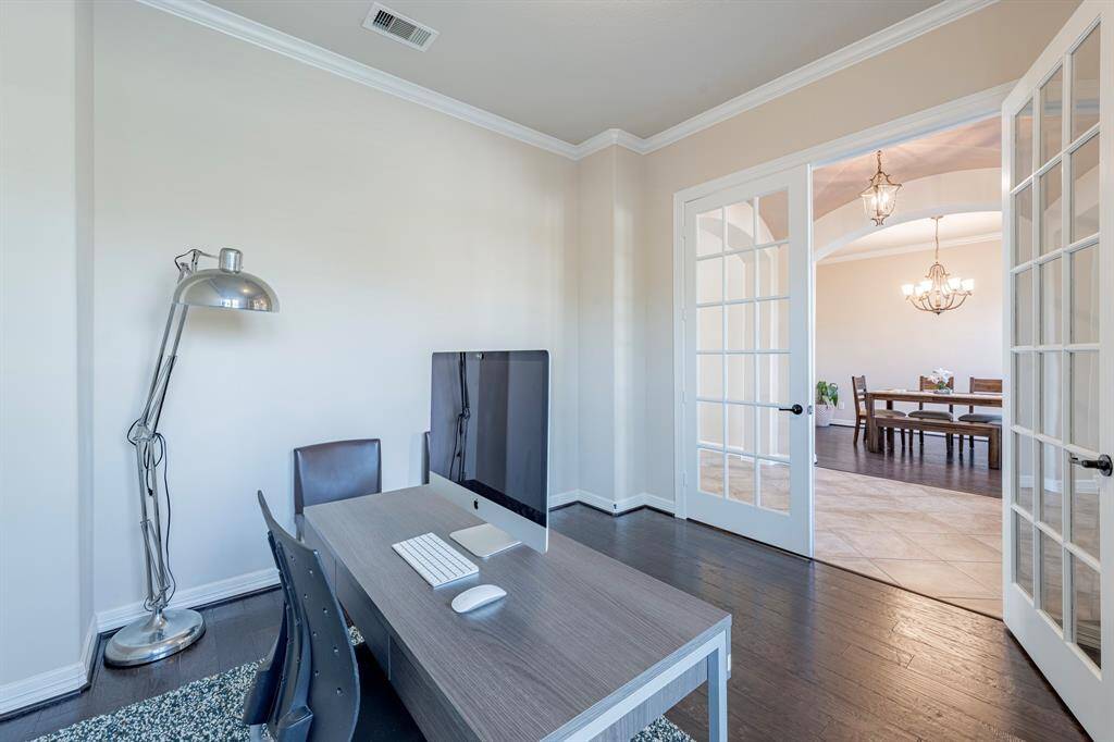 The study with Wood floors, French doors and conveniently located to the left of the entry.