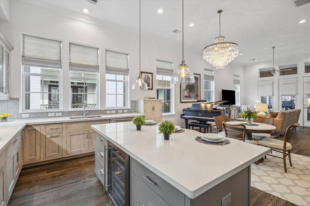 The kitchen is equipped with all stainless steel Bosch appliances. Both the Zephyr wine refrigerator and the Bosch full sized refrigerator/freezer convey with the home.