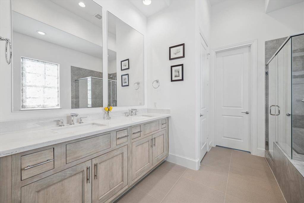 The primary features double sinks and marble counter tops.