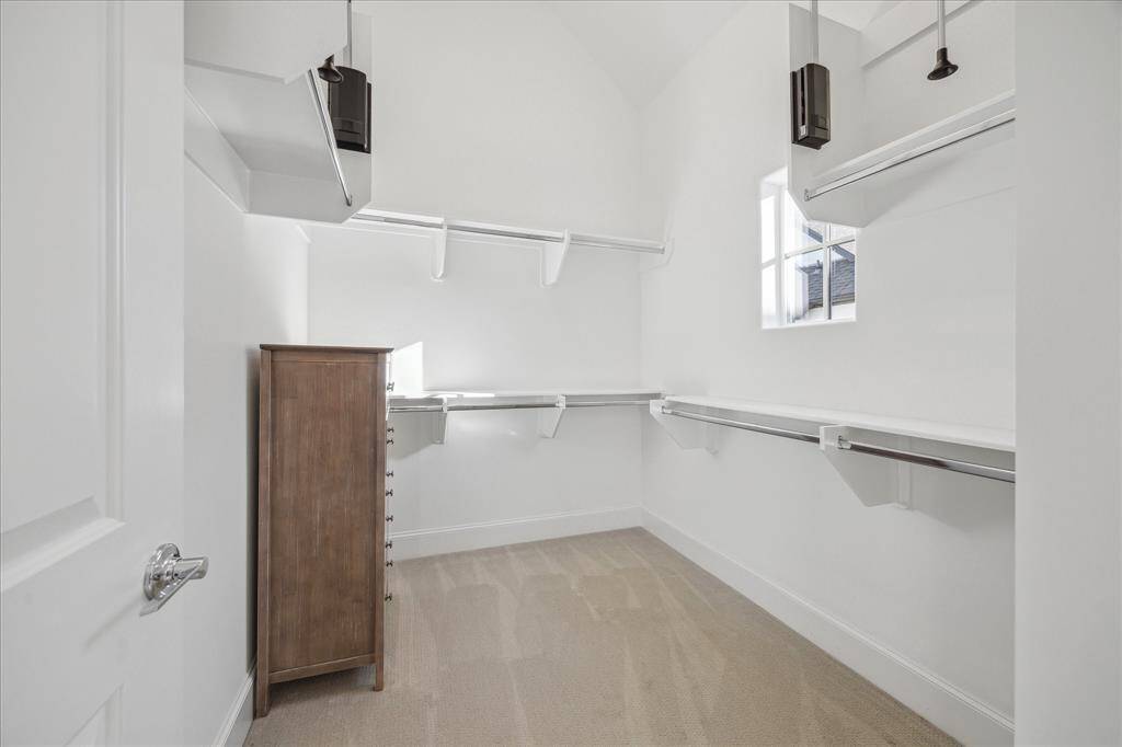 This is just one of the 3 walk-in closets in the primary suite. (The chest of drawers in this closet does not stay)