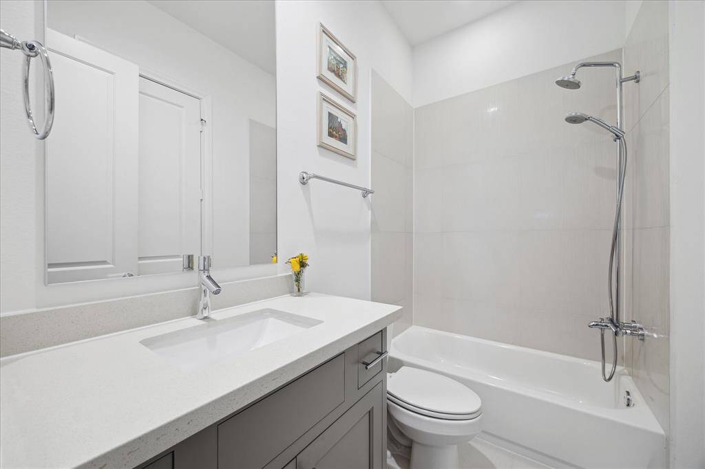 Ensuite bathroom in the secondary bedroom on the third floor.