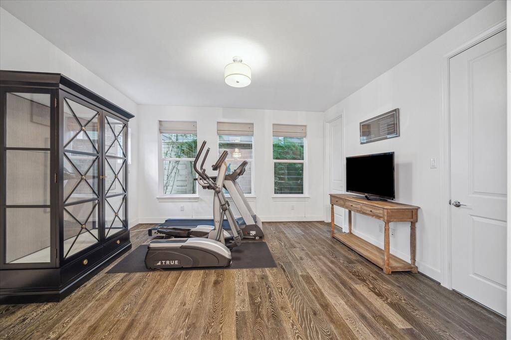 The first floor bedroom has a large closet and ensuite bathroom. This room is also a perfect home office, workout room or secondary family or gameroom.