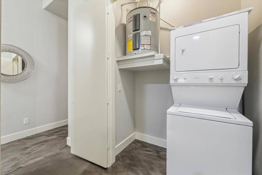 Stackable washer and dryer tucked away off the entry.