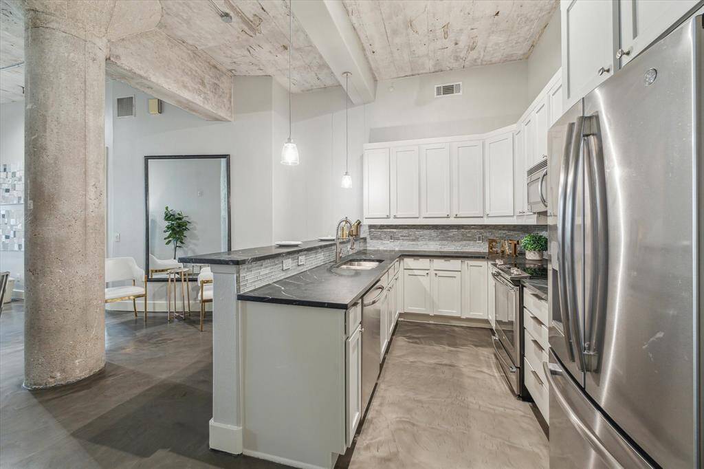 The kitchen is designed for maximum functionality with chic accents.