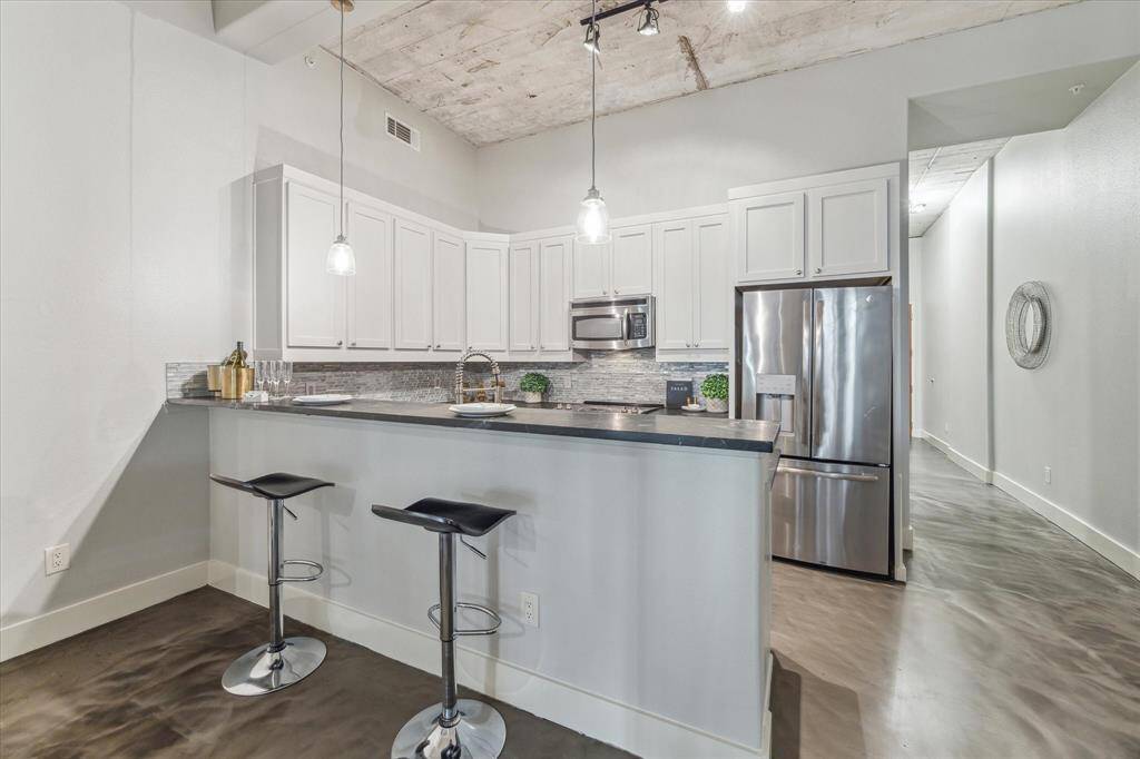 Space for multiple bar stools at the counter. This unit is an excellent space to entertain with a very flexible floor plan.