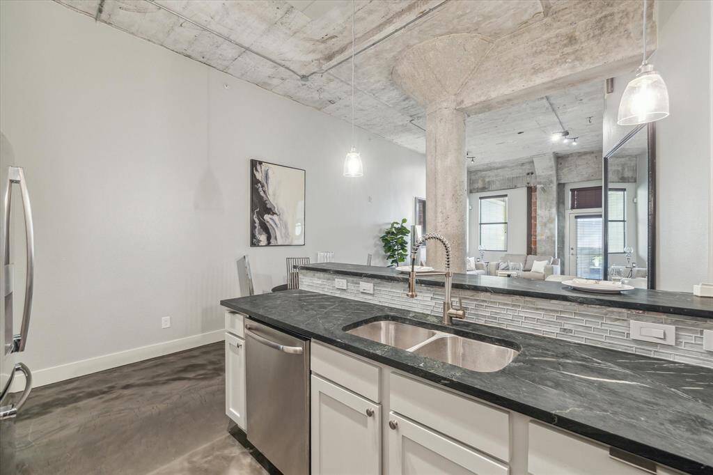 Soapstone countertops, stylish backsplash, stainless steel appliances, a large split sink and sprayer faucet add to the function and appeal!