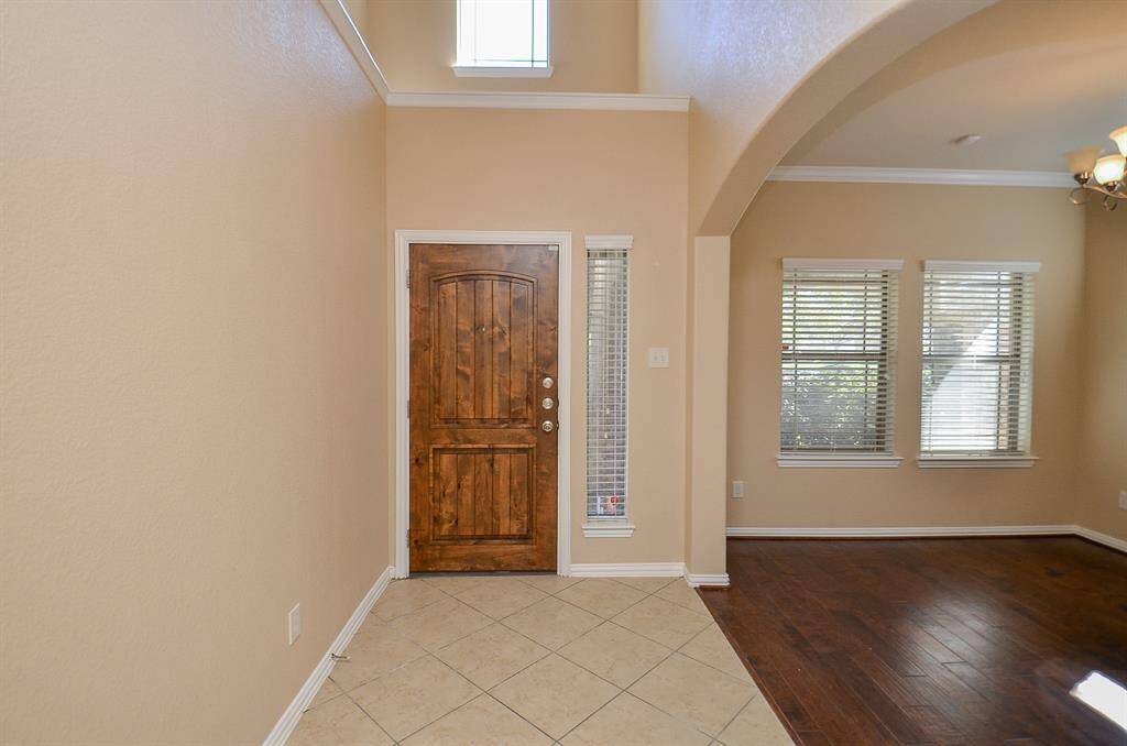 Welcoming entryway seamlessly connected to the dining room.