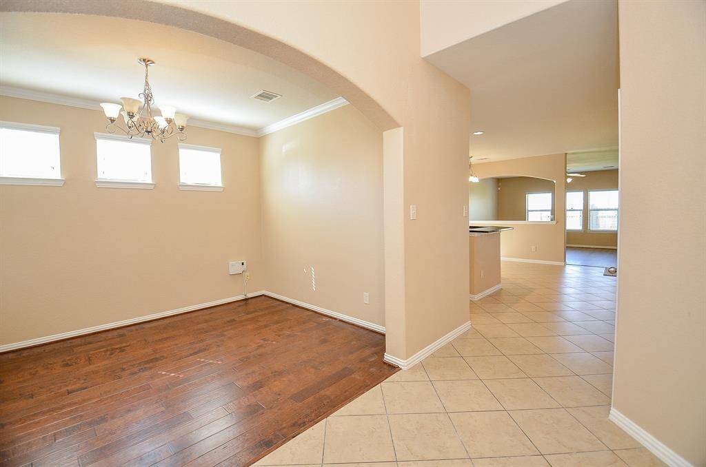 Experience the inviting warmth of this kitchen with its elegant wooden cabinetry.