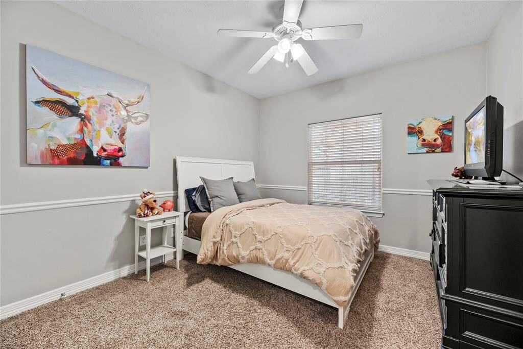 The thoughtfully designed layout of the third bedroom allows for natural light to flood the room, creating a warm and welcoming atmosphere.