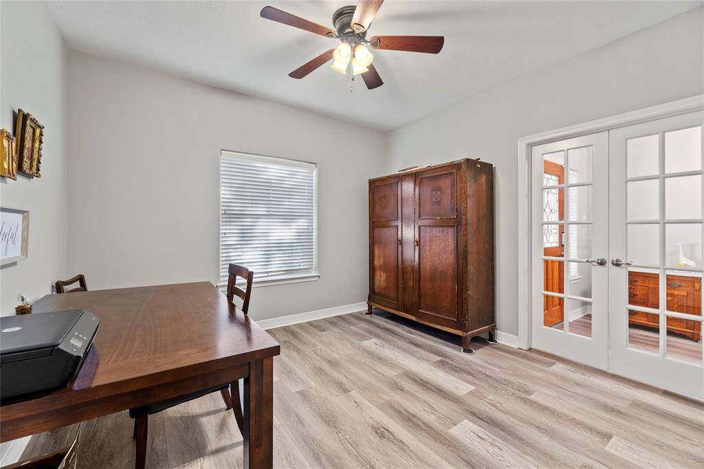 A private study through double glass doors adds a touch of sophistication and privacy to the home. The glass doors offer the option to keep the space visually connected to the rest of the home while still providing a degree of separation for focus and quiet.