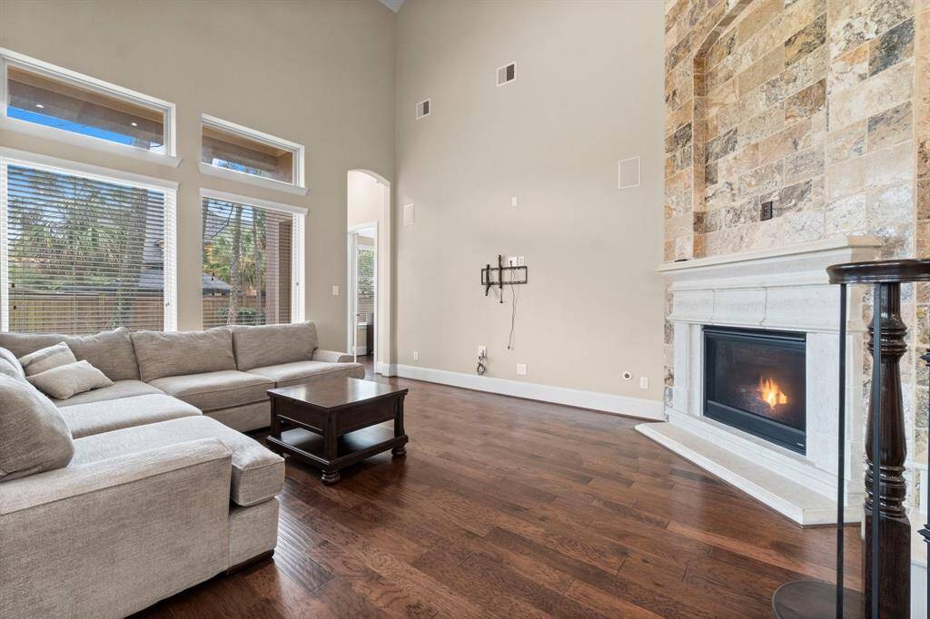 Family room with stone wall gas fireplace