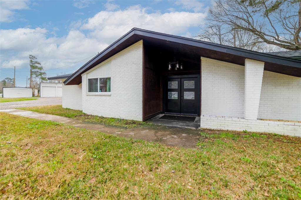 Covered front porch with new upgraded light fixture. Ready for your choice of landscaping.