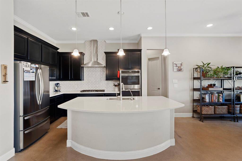 Step inside to find a fully-equipped kitchen, perfect for both everyday meals and entertaining.