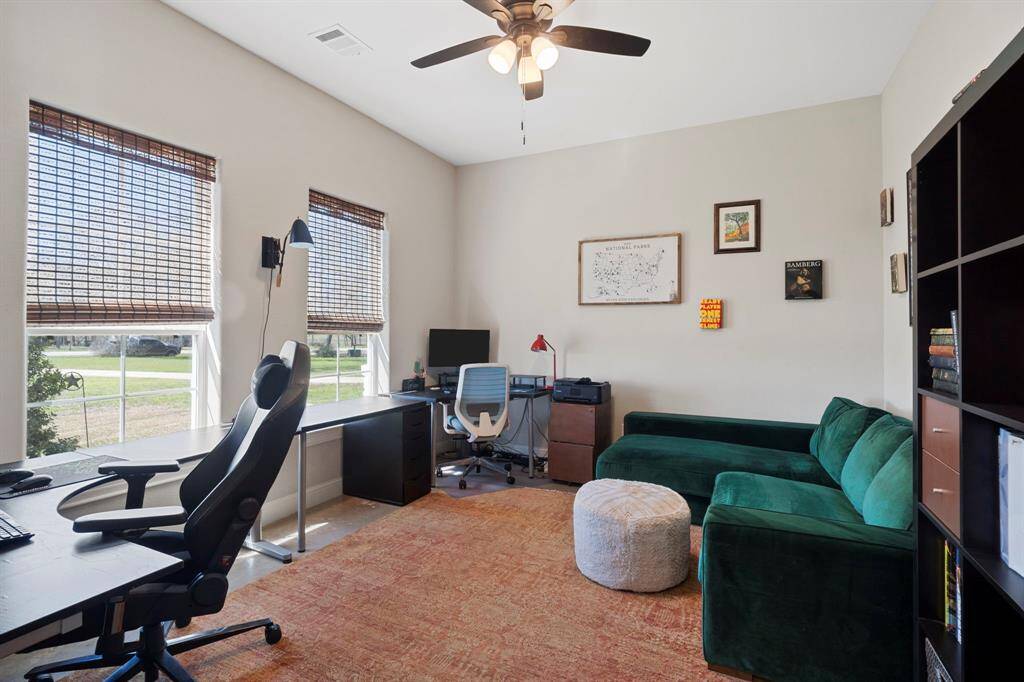 This spacious home office has plenty of room for multiple work stations and enjoys more fantastic views of the property.