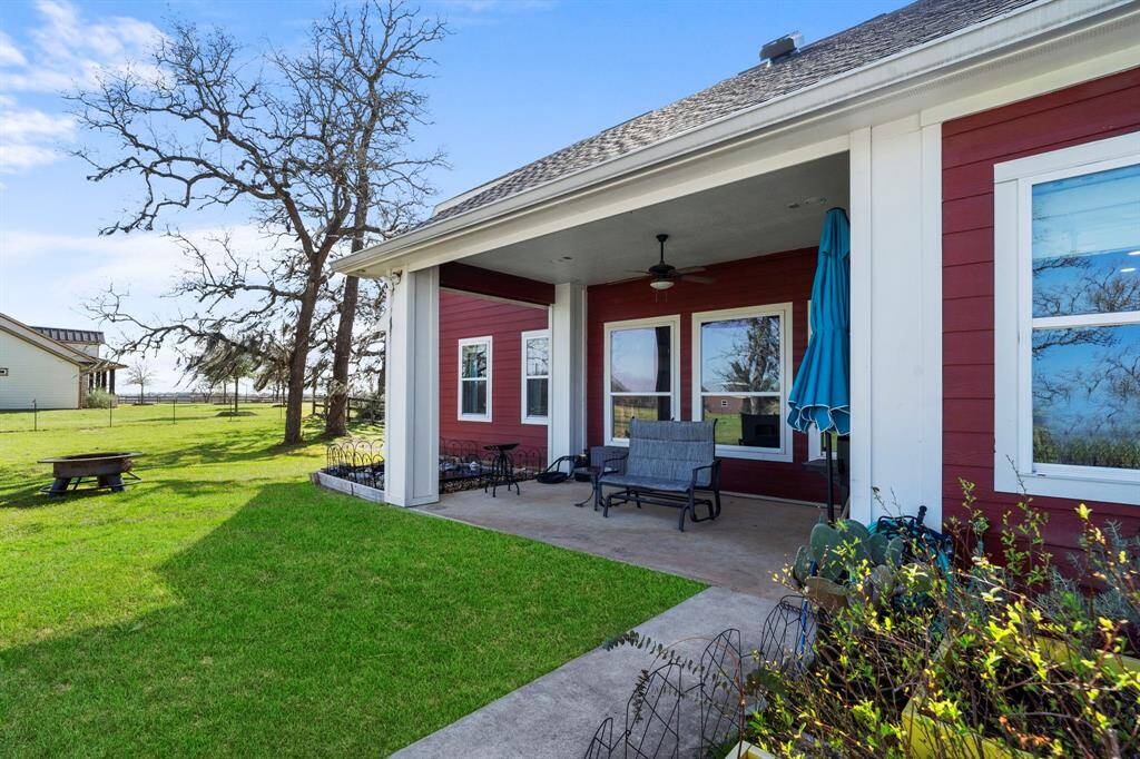 The covered back patio expands your living space, offering a shaded retreat and an ideal spot for grilling.